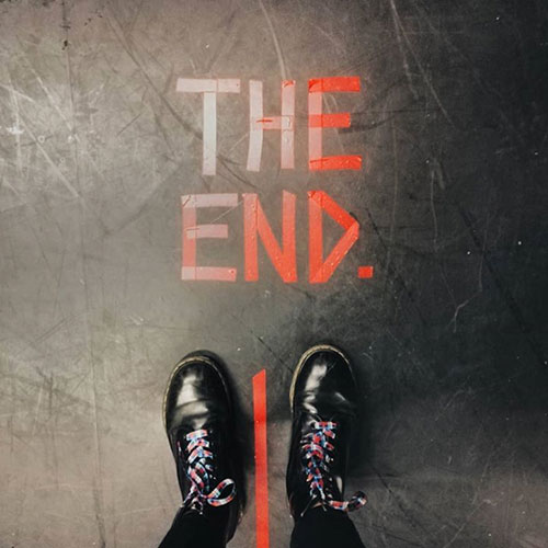 The words The End taped in red with two feet in the frame